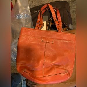 Orange leather coach